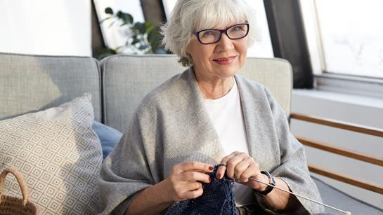 Older Woman Sat Knitting