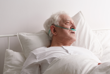 Older Man In Bed At Home Poorly