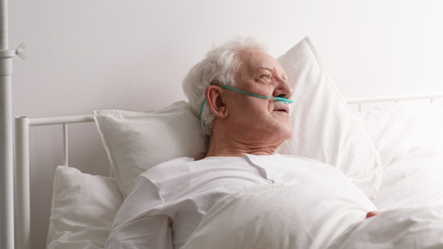 Older Man In Bed At Home Poorly