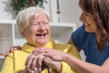 Older Woman Laughing With Other Woman