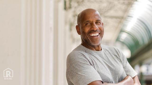 Older Man Looking At The Camera And Smiling